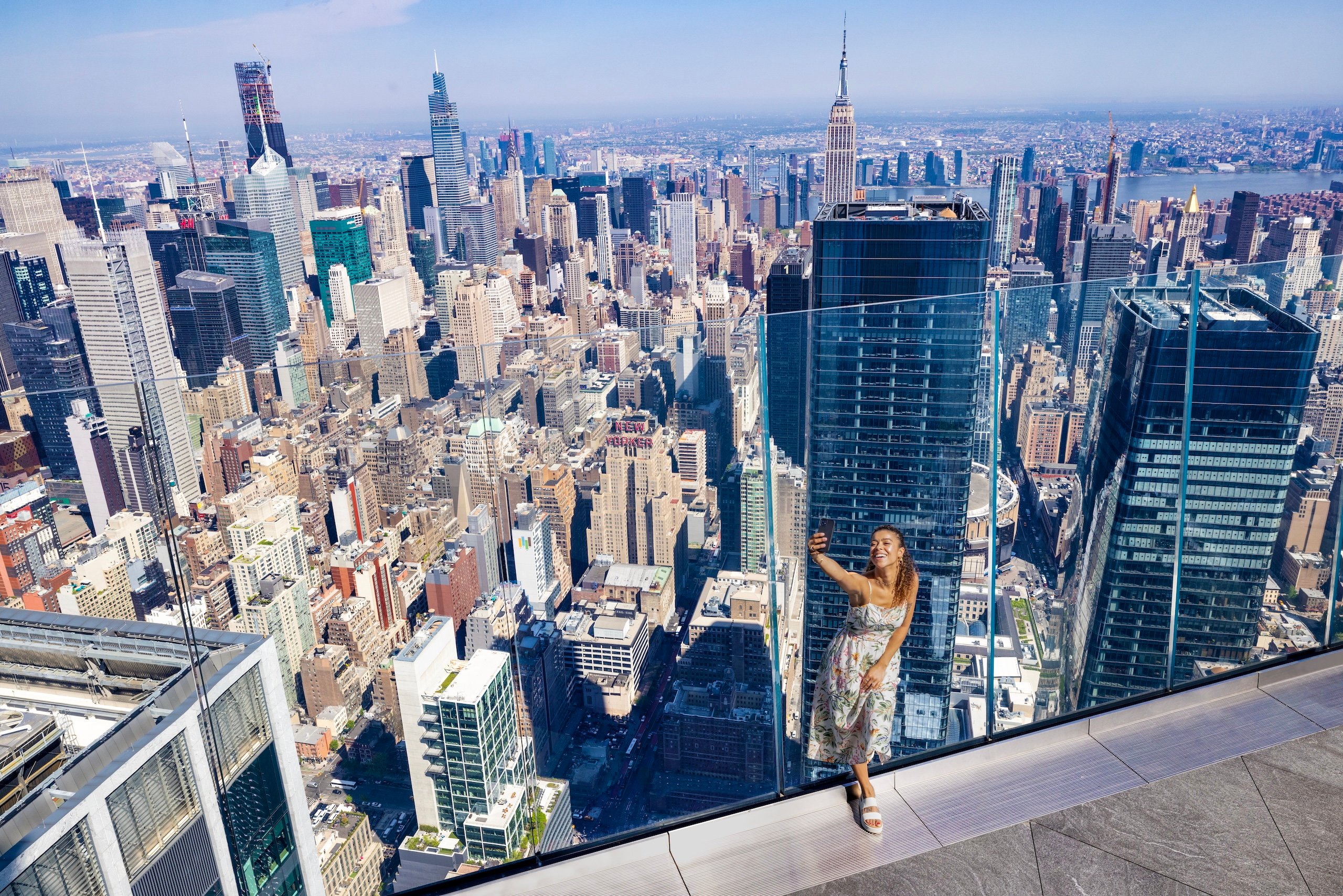 A woman takes a selfie at The Edge
