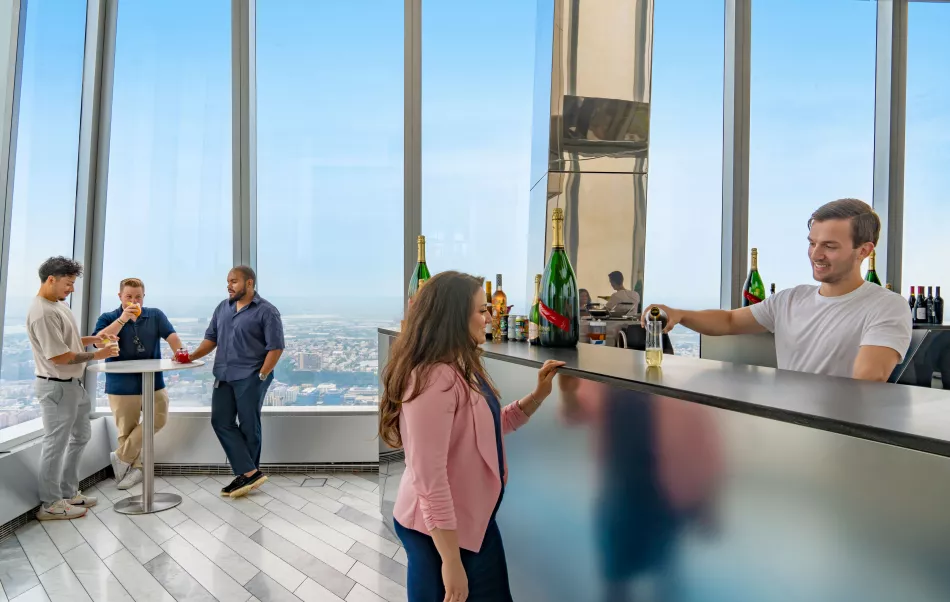 A corporate group enjoying cocktails and drinks at The Edge