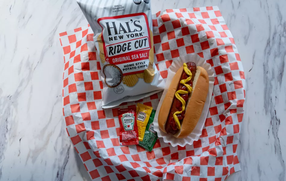 A hotdog and bag of chips from The Edge