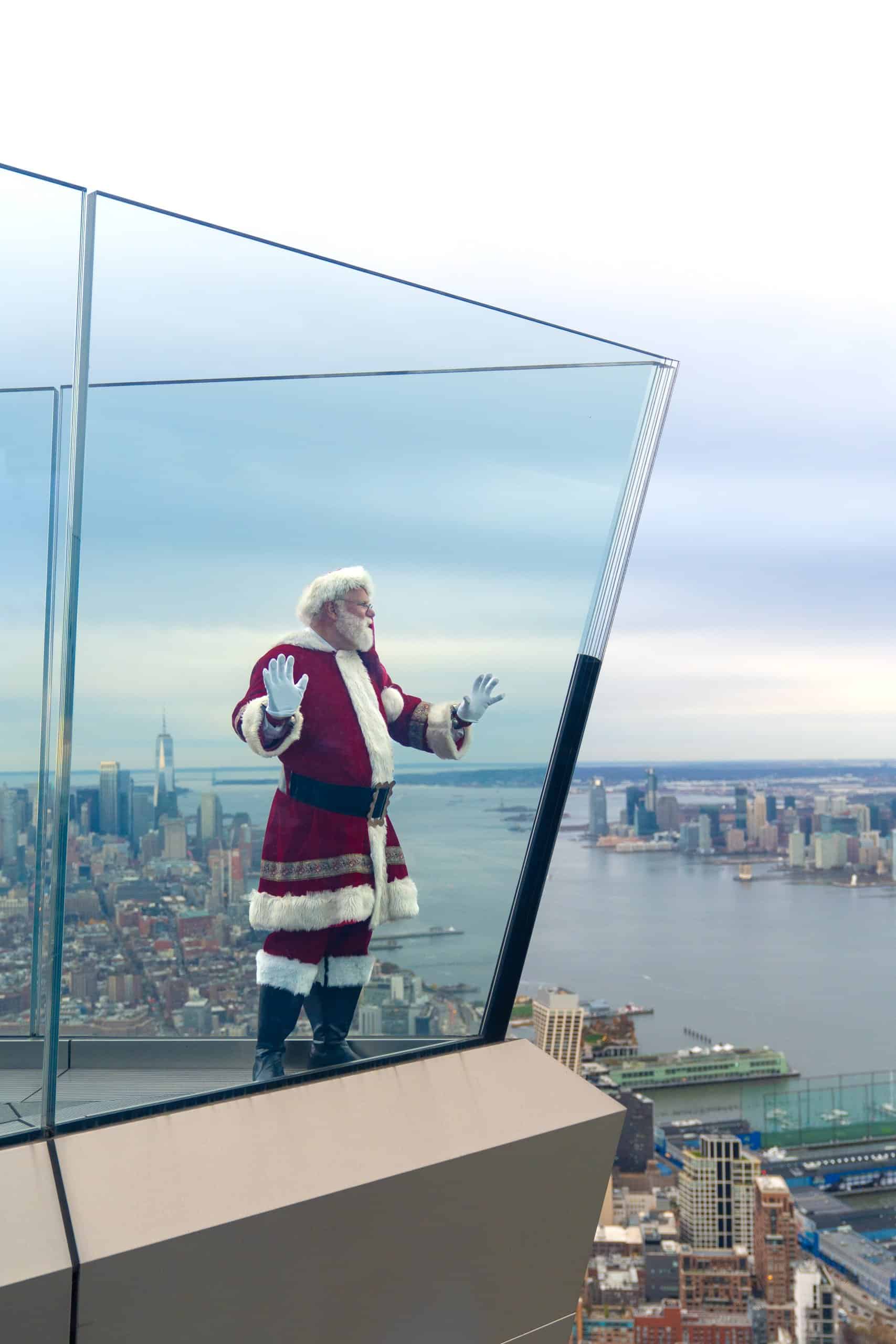 Santa holding the glass at the edge nyc