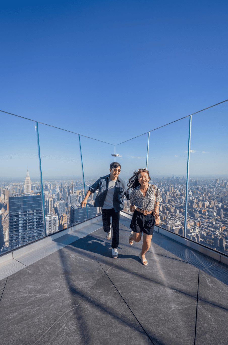 a young couple running at The Edge nyc
