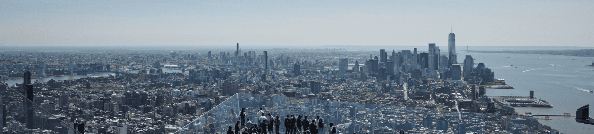 a group of people looking at NYC skyline during the day from The Edge NYC